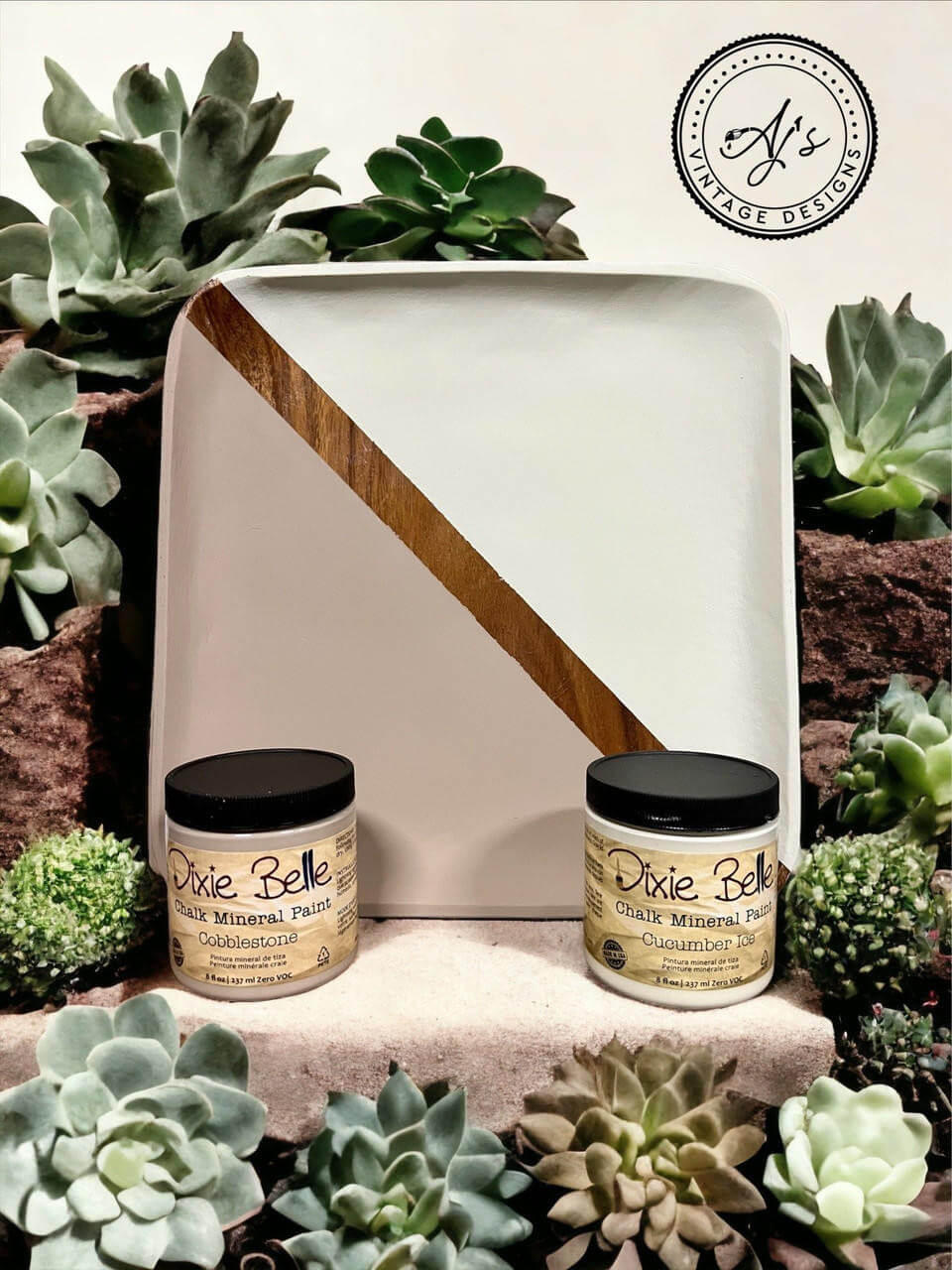 Wooden tray painted half with Cobblestone Chalk Mineral Paint and half with Cucumber Ice Chalk Mineral Paint. Staged with succulents surrounding the paint jars and wooden tray.
