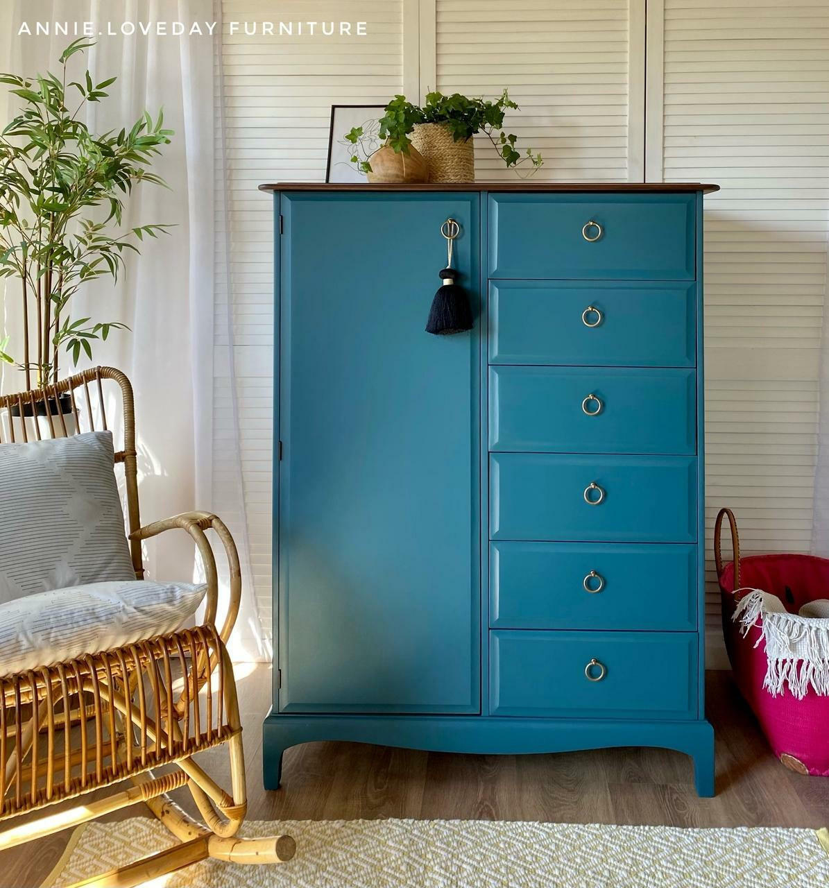 Dixie Belle Paint Antebellum Blue Chalk Mineral Paint is the perfect paint for any DIY project! Dresser painted in Antebellum Blue Chalk Mineral Paint staged with wicker chair in bedroom.