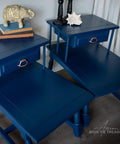 Dixie Belle Paint Bunker Hill Blue Chalk Mineral Paint is the perfect paint for any DIY project!
Vintage end table set painted in Bunker Hill Blue Chalk Mineral Paint. Staged with books and a golden elephant on top of one table the other had a seashell.