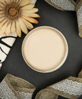 Dixie Belle Paint Burlap Chalk Mineral Paint is the perfect paint for any DIY project!
Opened container of Burlap Chalk Mineral Paint staged with a twirled tan ribbon and white lace, along with a yellow flower facing up and a white board with black words on a black background.