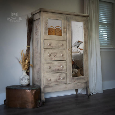 Dixie Belle Paint Burlap Chalk Mineral Paint is the perfect paint for any DIY project!
A chifferobe painted in Burlap Chalk Mineral Paint as well as Ancient Mud Cloth -Rice Decoupage Paper around the piece.