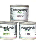 Dixie Belle Paint Chameleon Wax gives your furniture DIY project an iridescent glow and is sheer wax utilized to unveil the  highlight of your project!
Image shows the 3 containers and colors, which are Cactus, Lilac and apricot. of the  Chameleon Wax stacked on top of eachother on a white background.