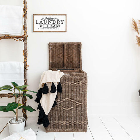 Dixie Belle Paint Chocolate Chalk Mineral Paint is the perfect paint for any DIY project!
Same rattan laundry basket painted in Chocolate Chalk Mineral Paint as above in full view. Staged with a white and black fringe blanket.