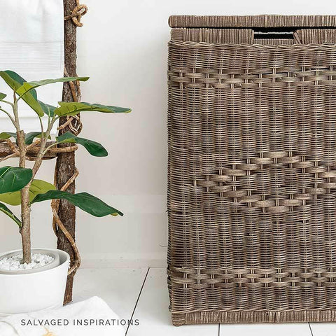 Dixie Belle Paint Chocolate Chalk Mineral Paint is the perfect paint for any DIY project!
A rattan laundry basket painted in Chocolate Chalk Mineral Paint. Staged with potted plant besides the piece.