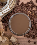 Dixie Belle Paint Chocolate Chalk Mineral Paint is the perfect paint for any DIY project!
Opened container of Chocolate Chalk Mineral Paint. Staged with chocolate chips and tan flowers.