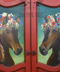 Dixie Belle Paint Chocolate Chalk Mineral Paint is the perfect paint for any DIY project!
Red Doors with panels has hand painted horses using Chocolate Chalk Mineral Paint to do so, with Dewy Morning Transfer on the horses head.