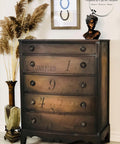 Dixie Belle Paint Chocolate Chalk Mineral Paint is the perfect paint for any DIY project!
Chest of drawers painted in Chocolate Chalk Mineral Paint with a bronze head statue on top.