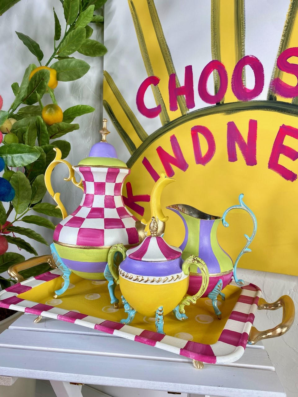 Dixie Belle Paint Daisy Chalk Mineral Paint  is the perfect paint for any DIY project! A metal tea set that is painted in daisy and an array of other colors such as pink and blue.