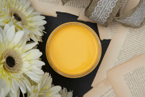 Dixie Belle Paint Daisy Chalk Mineral Paint is the perfect paint for any DIY project! A product image of an open paint can displaying the color daisy.