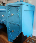 Dixie Belle Paint Dixie Belle Blue Chalk Mineral Paint is the perfect paint for any DIY project!
Vintage desk painted in  Dixie Belle Blue CMP with silver hardware and a black corner lined with silver for an accent.