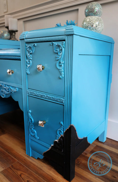 Dixie Belle Paint Dixie Belle Blue Chalk Mineral Paint is the perfect paint for any DIY project!
Vintage desk painted in  Dixie Belle Blue CMP with silver hardware and a black corner lined with silver for an accent.
