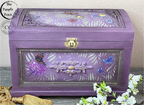 Dixie Belle Paint Dixie Dirt-4oz. 
Purple jewelry using Dixie dirt as an accent on the panels. Jewelry box has Enchanted Garden - Stencil and Wildflowers & Butterflies - Transfer on the inside of panels . Staged with white flowers around box.