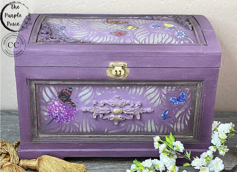 Dixie Belle Paint Dixie Dirt-4oz. 
Purple jewelry using Dixie dirt as an accent on the panels. Jewelry box has Enchanted Garden - Stencil and Wildflowers & Butterflies - Transfer on the inside of panels . Staged with white flowers around box.