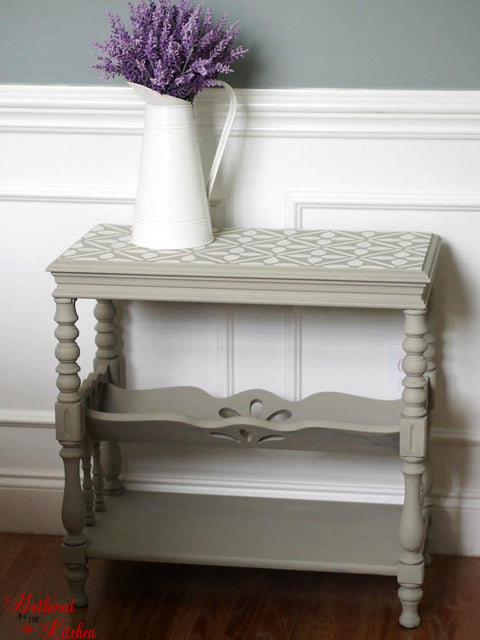 Dixie Belle Paint Dried Sage Chalk Mineral Paint  is the perfect paint for any DIY project!
This DIY furniture flip of beautiful entry table painted in Dried Sage Chalk Mineral Paint. Staged with a large white pitcher with lavender flowers inside.