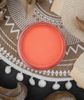 Dixie Belle Paint Flamingo Chalk Mineral Paint is the perfect paint for any DIY project!
Opened container of  Flamingo Chalk Mineral Paint staged with book pages, brown flower and a brown and white boho rug.