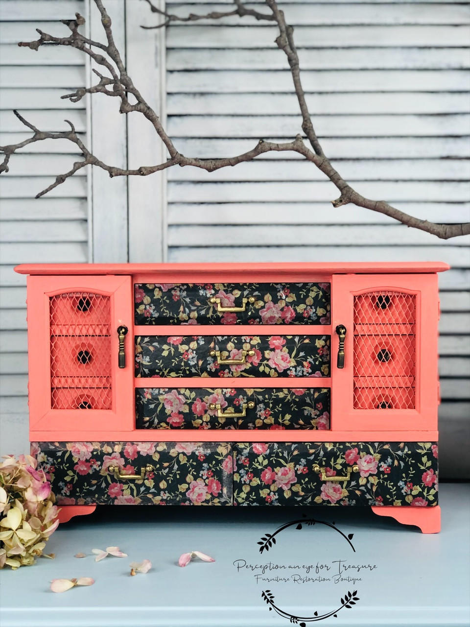 Dixie Belle Paint Flamingo Chalk Mineral Paint is the perfect paint for any DIY project!
Vintage jewelry box painted in Flamingo Chalk Mineral Paint with the drawers decoupage in Peony Pattern - Rice Paper. Staged on a white panel background, a branch is seen above the piece.