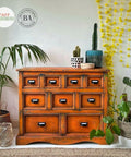 Dixie Belle Paint Florida Orange Chalk Mineral Paint is the perfect paint for any DIY project! An apothecary dresser chalk painted with Florida orange chalk paint and dark glaze.