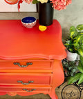 Dixie Belle Paint Florida Orange Chalk Mineral Paint is the perfect paint for any DIY project! An overhead shot of a orange chalk painted dresser painted with Florida Orange chalk paint.