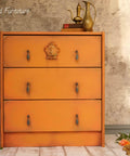 Dixie Belle Paint Florida Orange Chalk Mineral Paint is the perfect paint for any DIY project! A dresser chalk painted with Florida Orange chalk paint.