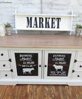 Dixie Belle Paint Fluff Chalk Mineral Paint - best chalk paint for furniture.  A farmhouse entertainment center chalk painted with Fluff chalk paint and decals of farm animals on the doors.  Fluff is a serene, soft white with a slight gray undertone. Use Fluff for traditional or modern style projects.

You can also pair this paint color with a dark wax or glaze to create distressed farmhouse furniture. Fluff is a crisp color, perfect for any room in your home!