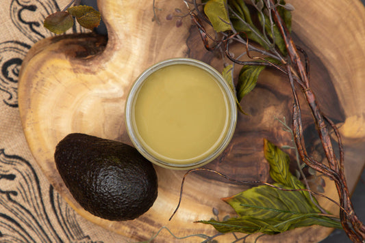 Dixie Belle Paint Holy Guacamole Chalk Mineral Paint is the perfect paint for any DIY project!
Top view of an opened container of Holy Guacamole Chalk Mineral Paint staged on top of a wooden board with greenery and an avocado.