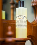 Dixie Belle Paint Howdy-Do Hemp Oil is the perfect choice for a sealant for your furniture. Bottle of Howdy-Do Hemp Oil on a wooden frame.