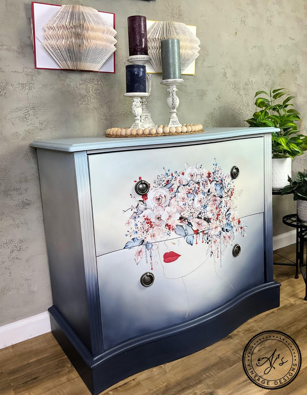 Dixie Belle Paint In the Navy Chalk Mineral Paint is the perfect paint for any DIY project!
a 2 drawer dresser with an ombre effect painted with the following colors; In The Navy CMP,French Linen CMP,Drop Cloth CMP,Savannah Mist CMP,Apricot CMP. As well as the Bohemian Wedding - Transfer on the center of the dresser.  Staged with white candle pedestal with a red,green,blue candle on each on top of the piece.