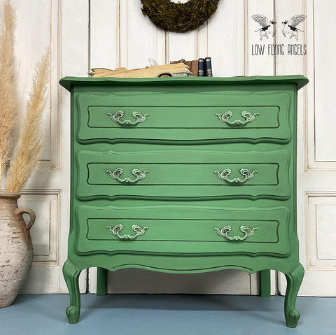 Dixie Belle Paint Kudzu Chalk Mineral Paint is the perfect paint for any DIY project!
Dresser painted in Kudzu Chalk Mineral Paint with matching hardware. Staged with books on top of the piece.