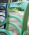 Dixie Belle Paint Kudzu Chalk Mineral Paint is the perfect paint for any DIY project!
An image of a wooden chair close up on the back support painted in Kudzu Chalk Mineral Paint.