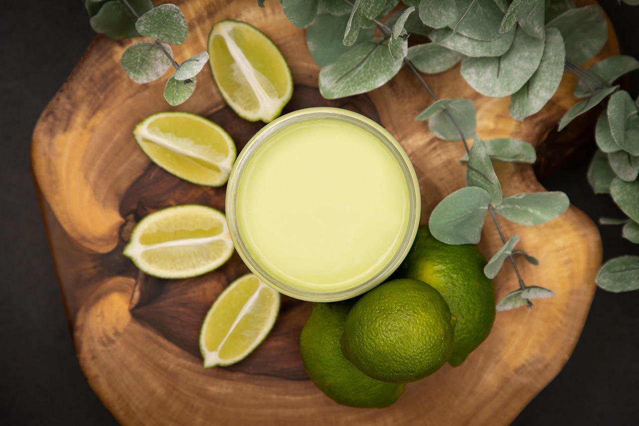 Dixie Belle Paint Limeade Chalk Mineral Paint is the perfect paint for any DIY project!
Opened container of Dixie Belle Paint Limeade Chalk Mineral Paint is the perfect paint for any DIY project! staged around the container are sliced limes and 3 whole limes with greenery on top of a wooden board.