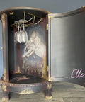 Dixie Belle Paint Manatee Gray Chalk Mineral Paint is the perfect paint for any DIY project! Chalk Painted dark Gray, Red and Gold and Black Wine Cabinet with a Ballerina Decoupage Tissue Paper. Staged with glass wine glasses inside.