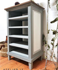 Dixie Belle Paint Manatee Gray Chalk Mineral Paint is the perfect paint for any DIY project! Chalk Painted Gray Bookcase with White Chalk Painted side.