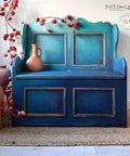 Dixie Belle Paint Mermaid Tail Chalk Mineral Paint is the perfect paint for any DIY project! Dark blue and teal chalk painted Ombre Bench with terra color vase on top.