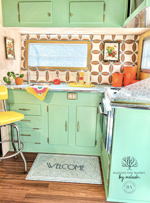 Dixie Belle Paint Mint Julep Chalk Mineral Paint is the perfect paint for any DIY project! retro kitchen with cabinets painted in mint green chalk paint. Staged with retro vintage kitchen décor and a welcome mat.