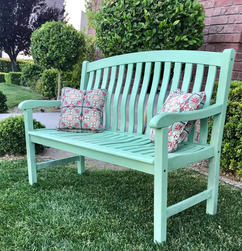 Dixie Belle Paint Mint Julep Chalk Mineral Paint is the perfect paint for any DIY project!
Mint Green chalk painted bench staged outside with colorful pillows.