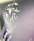 Moonshine metallic is the perfect paint to add shimmer and shine to your chalk painted furniture. Purple metallic chalk painted chair with white florally stencil.