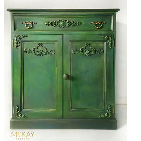 Deep Woods Moonshine metallic is the perfect paint to add shimmer and shine to your chalk painted furniture. Green Ombre  metallic chalk mineral painted cabinet.
