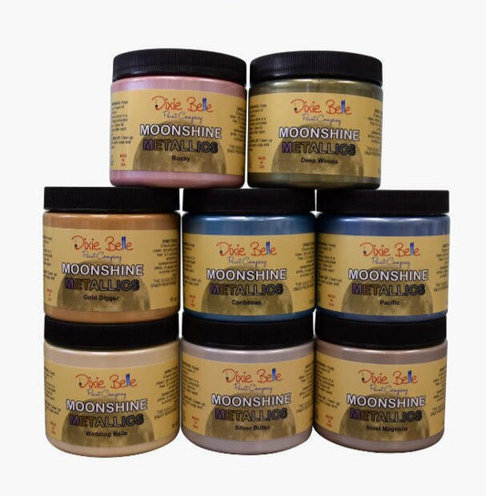 Moonshine metallic is the perfect paint to add shimmer and shine to your chalk painted furniture. Moonshine metallic paint 16 oz. jars stacked on top of each other.