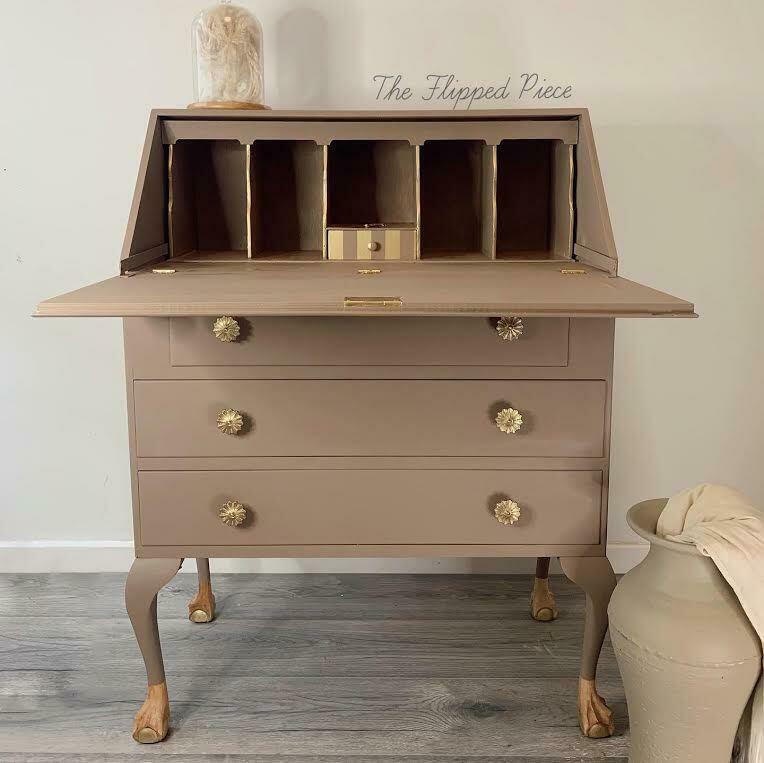 Dixie Belle Paint Mud Puddle Chalk Mineral Paint is the perfect paint for any DIY project! Secretary desk painted in Dixie Belle Paint Mud Puddle Chalk Mineral Paint. Staged with glass cloche with a plant inside.