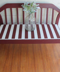 Dixie Belle Paint Muscadine Wine Chalk Mineral Paint is the perfect paint for any DIY project! Bench painted with dark red Chalk Mineral Paint with white stripes on the seat. Staged with glass vase and plants inside.