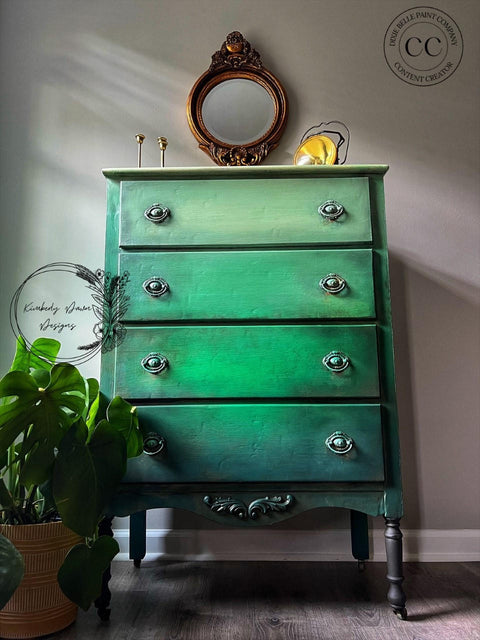 Dixie Belle Paint Palmetto Chalk Mineral Paint is the perfect paint for any DIY project! Green chalk painted Ombre dresser. Staged with a potted plant, candle sticks and a gold mirror.