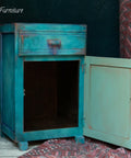 Dixie Belle Paint Peacock Chalk Mineral Paint is the perfect paint for any DIY project! Blue chalk painted end table cabinet with red chalk paint blended to make it look distressed.