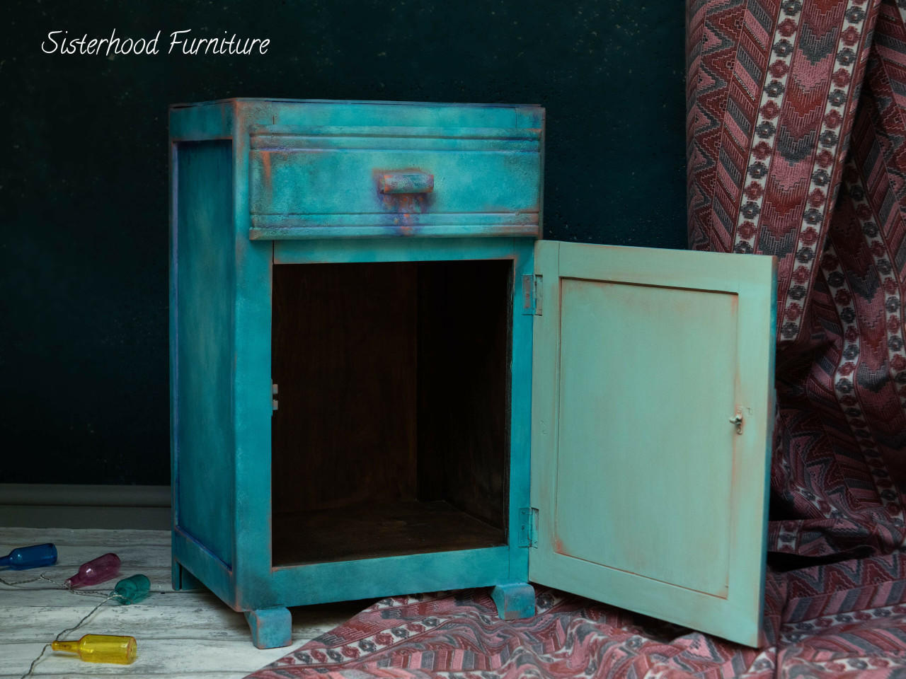 Dixie Belle Paint Peacock Chalk Mineral Paint is the perfect paint for any DIY project! Blue chalk painted end table cabinet with red chalk paint blended to make it look distressed.