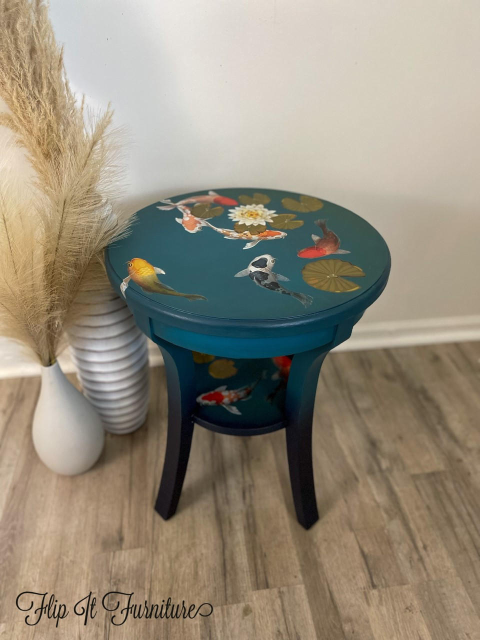 Dixie Belle Paint Peacock Chalk Mineral Paint is the perfect paint for any DIY project! Blue chalk painted end table with koi fish rub on transfers.