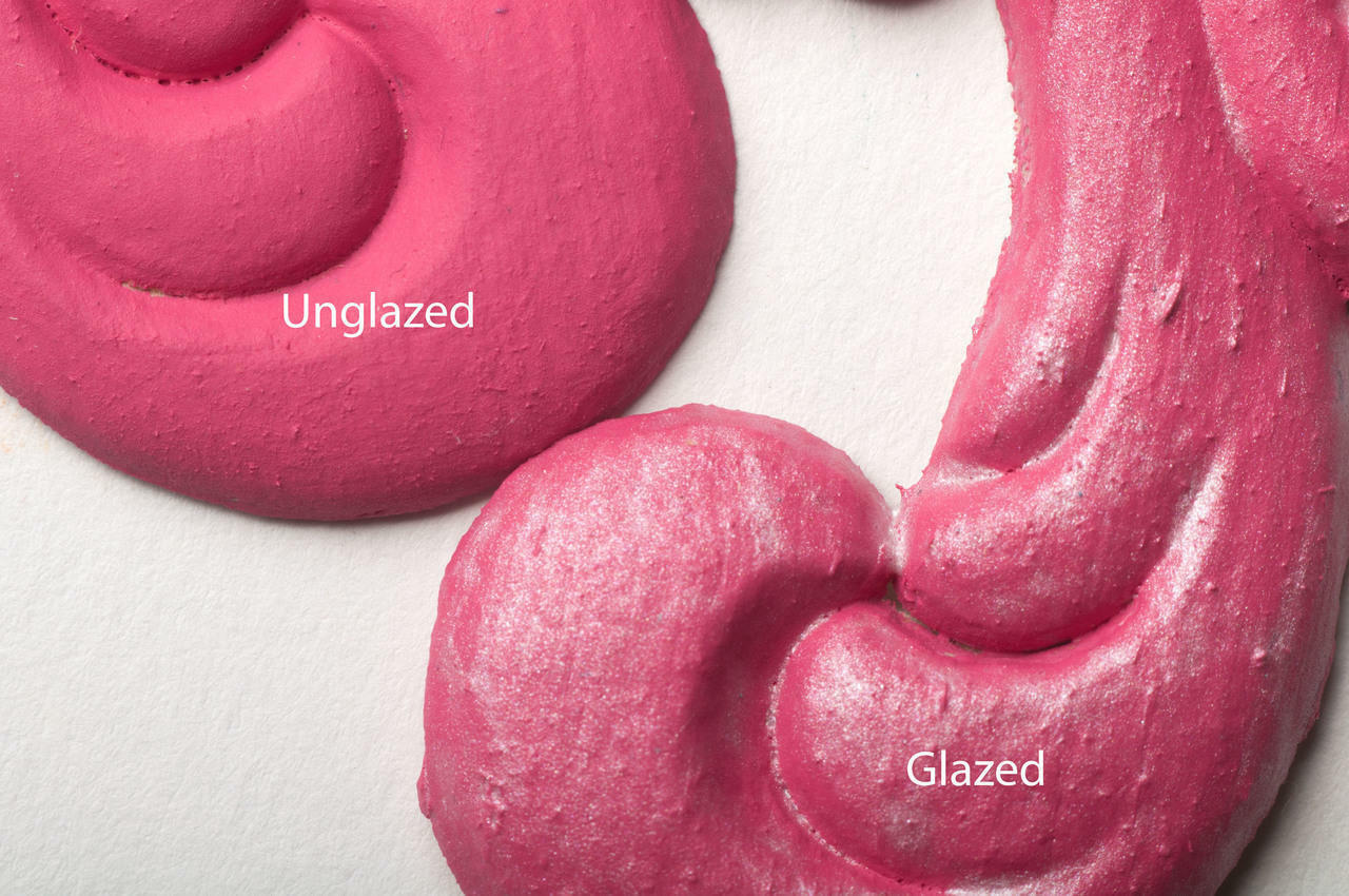 Dixie Belle Paint Pearlescent Glaze. Two pieces of pink chalk painted decorative appliques, one without glaze and one with glaze applied, with a white background.