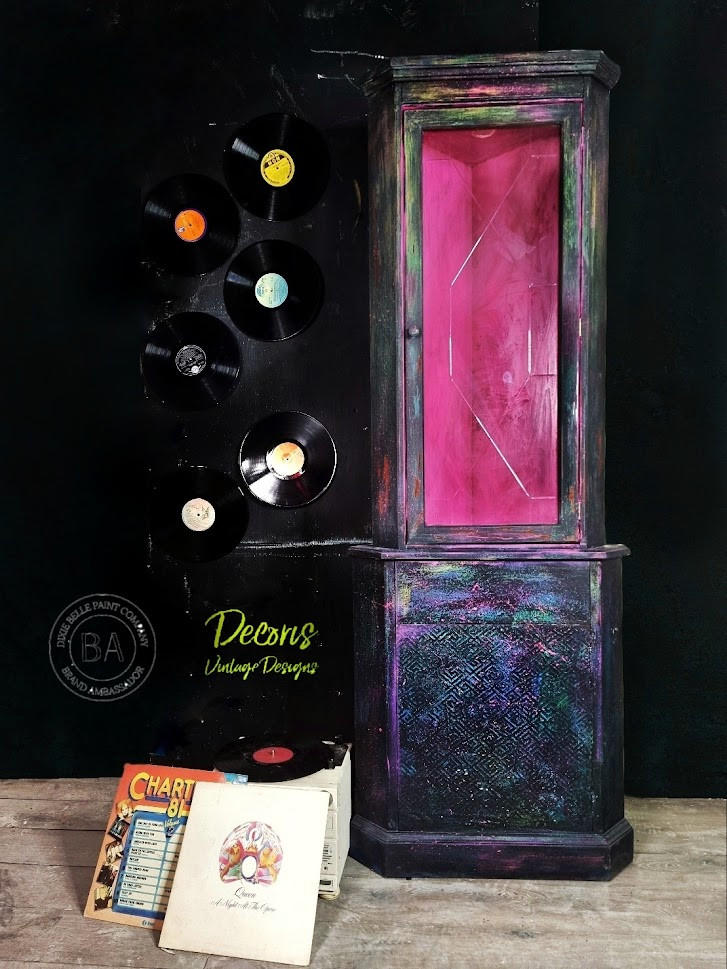 Dixie Belle Paint Peony Chalk Mineral Paint is the perfect paint for any DIY project! Pink chalk painted Black chalk painted display cabinet with colorful splatters of chalk paint. Pink chalk painted inside staged with records.