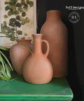 Dixie Belle Paint Pine Cone Chalk Mineral Paint is the perfect paint for any DIY project! Light brown Chalk mineral painted vases made to look like clay vases.