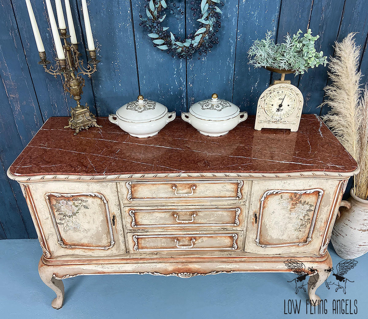 Dixie Belle Paint Pine Cone Chalk Mineral Paint is the perfect paint for any DIY project! Light brown Chalk mineral painted dresser distressed to make look chippie. Staged with candle stick holder and ceramic pots and vintage scale.
