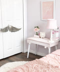 Dixie Belle Paint Pink Champagne Chalk Mineral Paint is the perfect paint for any DIY project! End table in a bedroom painted light pink chalk mineral paint. Staged with a lamp and some girly décor.