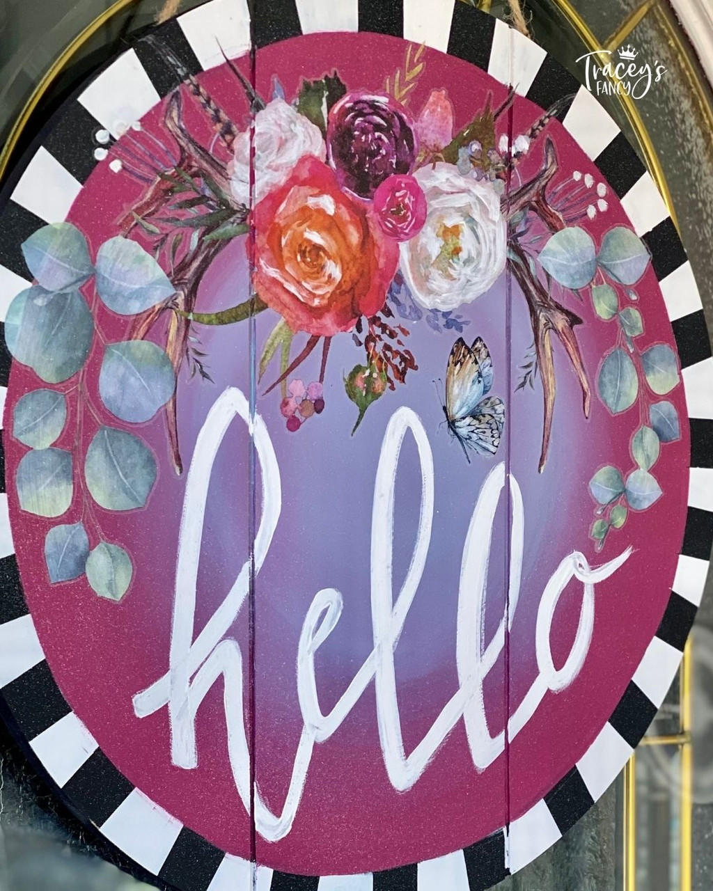 Dixie Belle Paint Plum Crazy Chalk Mineral Paint is the perfect paint for any DIY project! Wood sign chalk painted with maroon and purple blended together in the middle and black and white stripes on the edges. White hello is painted in the middle with floral rub on transfers.